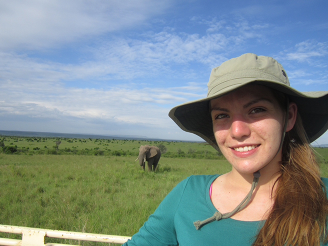 A photo of GMU student Andrea Broad with an elephant while on safari. Photo by: Andrea Broad