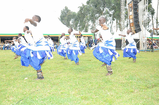 Male dancers perform at the 2013 Kwita Izina Mountaing Gorilla naming ceremony. Photo by: Anna Behm-Masozera