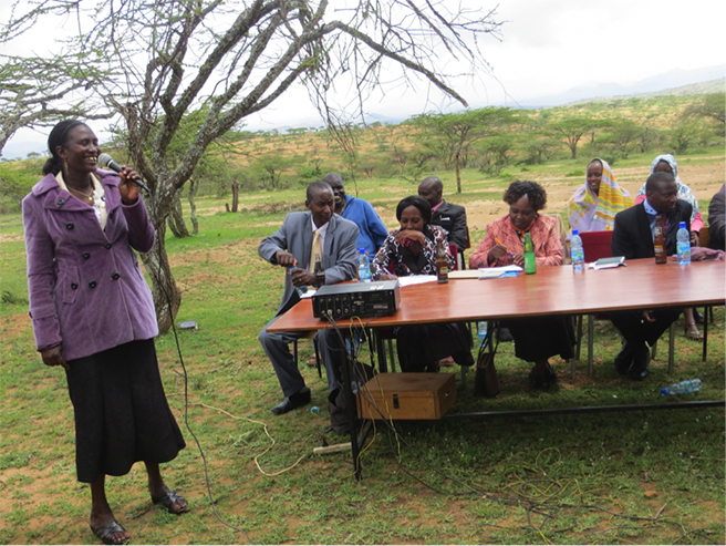 Jane Meshami, shown here addressing the general meeting for the Nasaruni Savings and Credit Cooperative Organization in northern Kenya, says this AWF project has helped the community in innumerable ways.