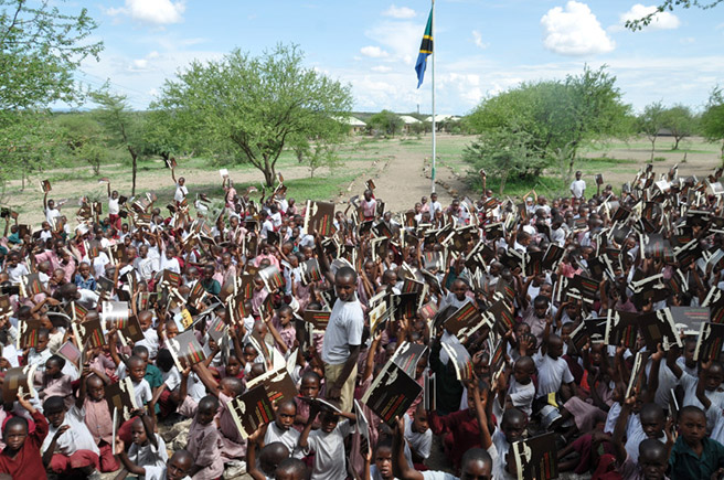 Children reading Lucky the Wildebeest book