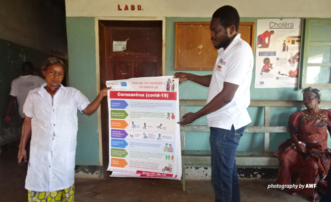 AWF distributing COVID-19 posters in Bili-Uele