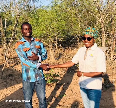 Photo of ranger Luckmore Machipisa and Olivia Mufute in Save Valley Conservancy in Zimbabwe