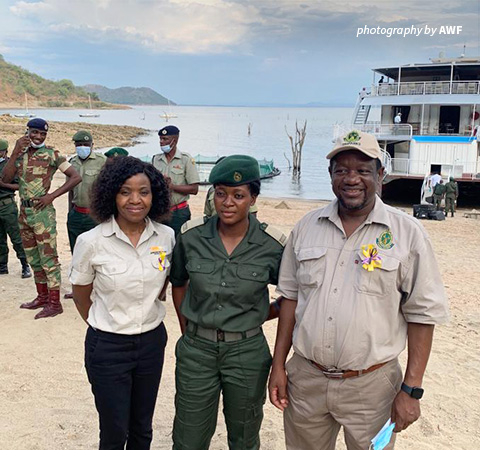 Photo of Zimparks woman ranger with AWF Country Director and Zimparks DG