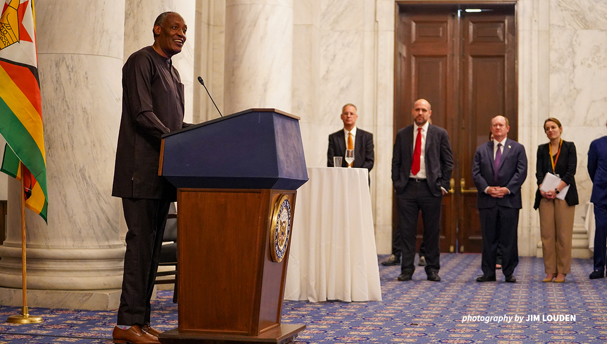 Photo of Kaddu Sebunya at a podium.