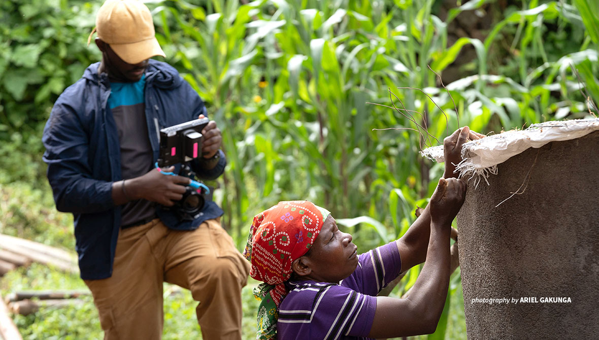 ACV fellow filming woman making water tank