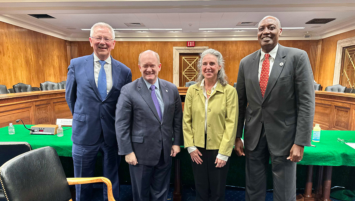 Dr. Andrew Steer, Senator Chris Coons, Gillian Caldwell, and Kaddu Sebunya pose for a photo