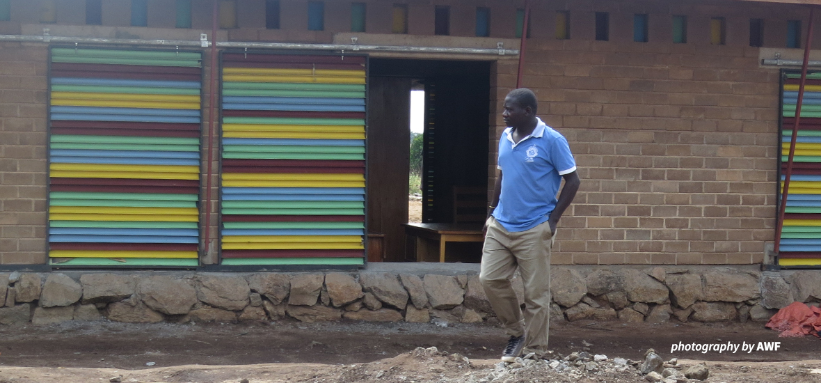 Timothy inspects a Classroom Africa school construction site.