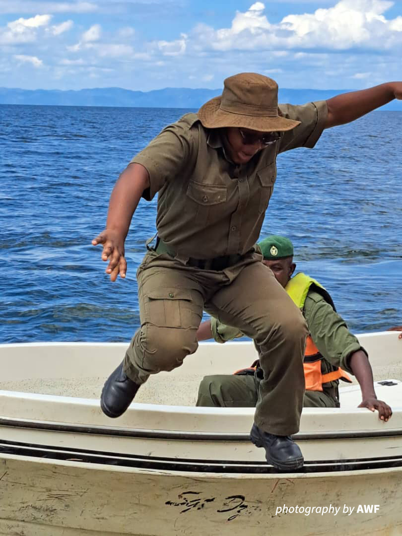 Brenda jumping out of a boat