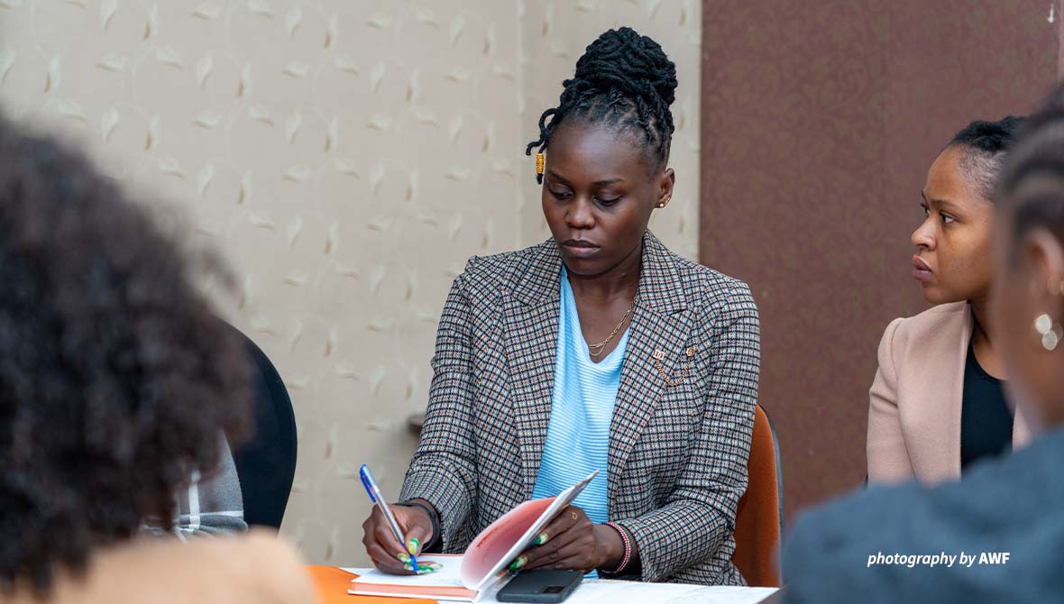 Jane Otieno at a desk