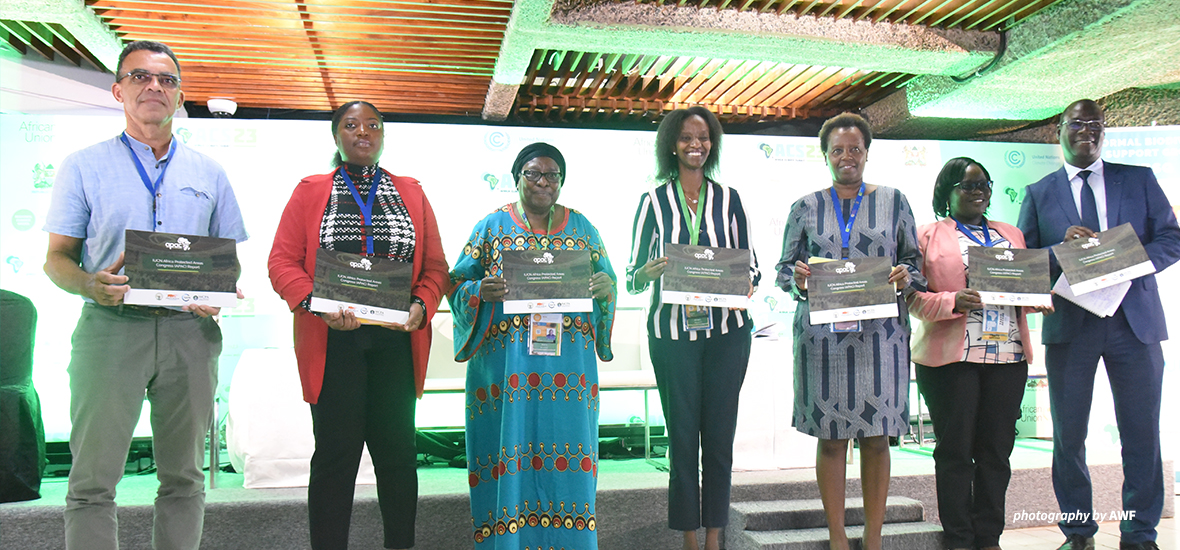 The panelists gathered with copies of the APAC Report.