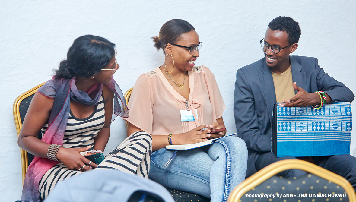 Three fellows having a conversation.