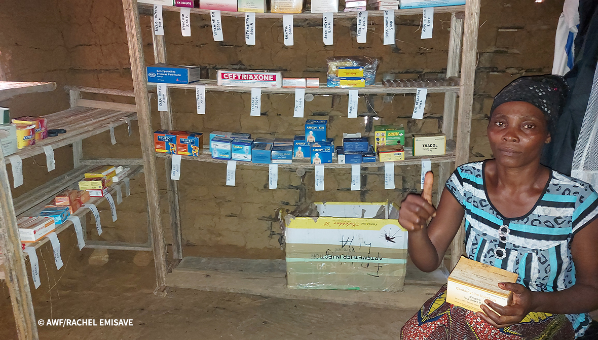 A person stands inside a mobile pharmacy.