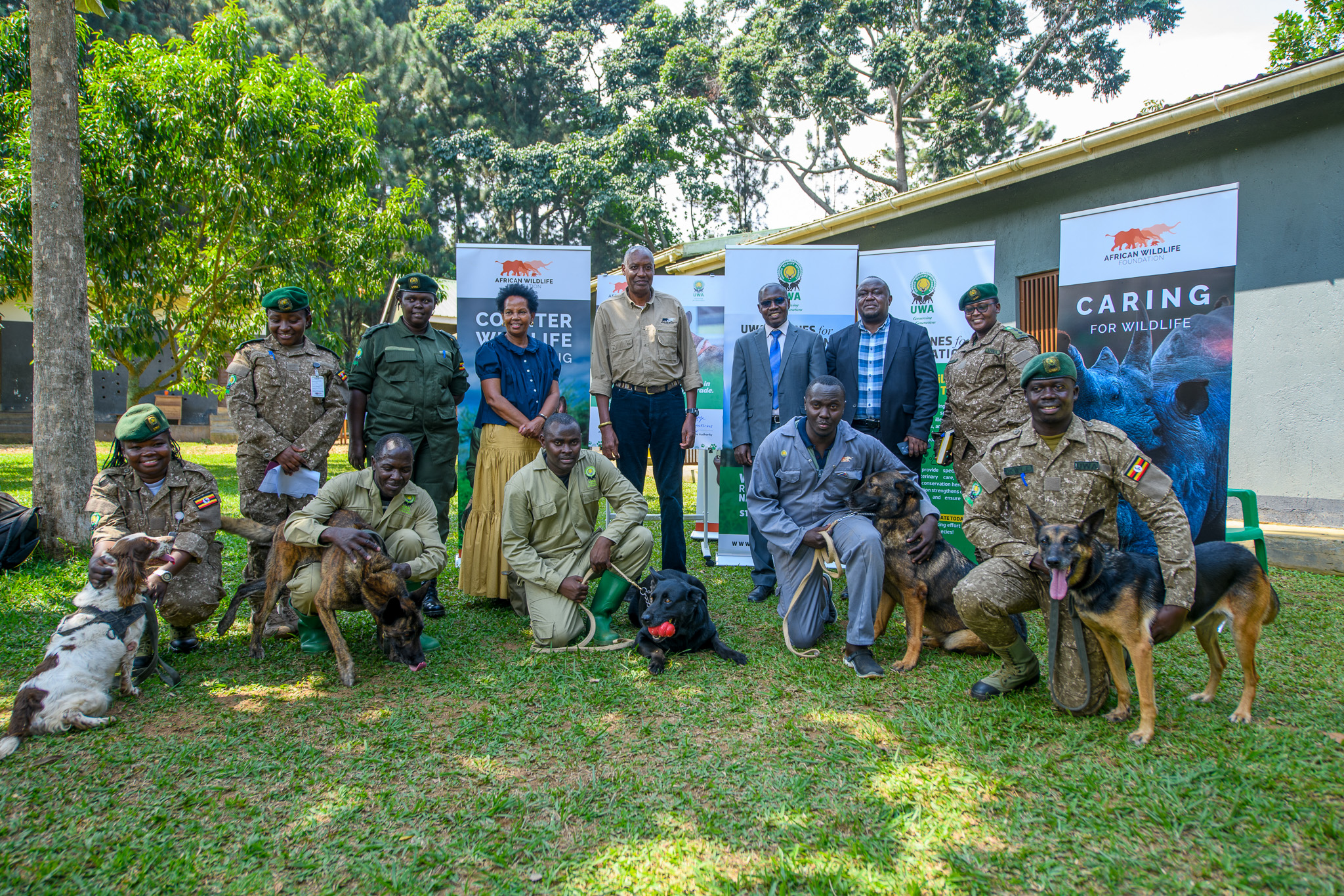 AWF CEO, Kaddu Sebunya, AWF Uganda Country Director Rose Ssebatindira and Uganda Wildlife Authority Representatives during the program transition ceremony for the Canine Units in Uganda