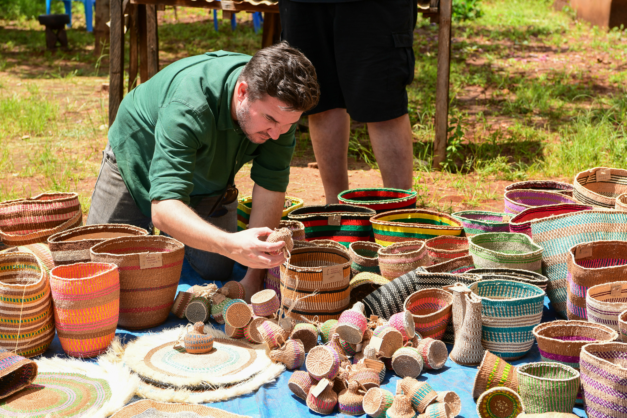 Tourist admiring some of the local made sisal baskets.