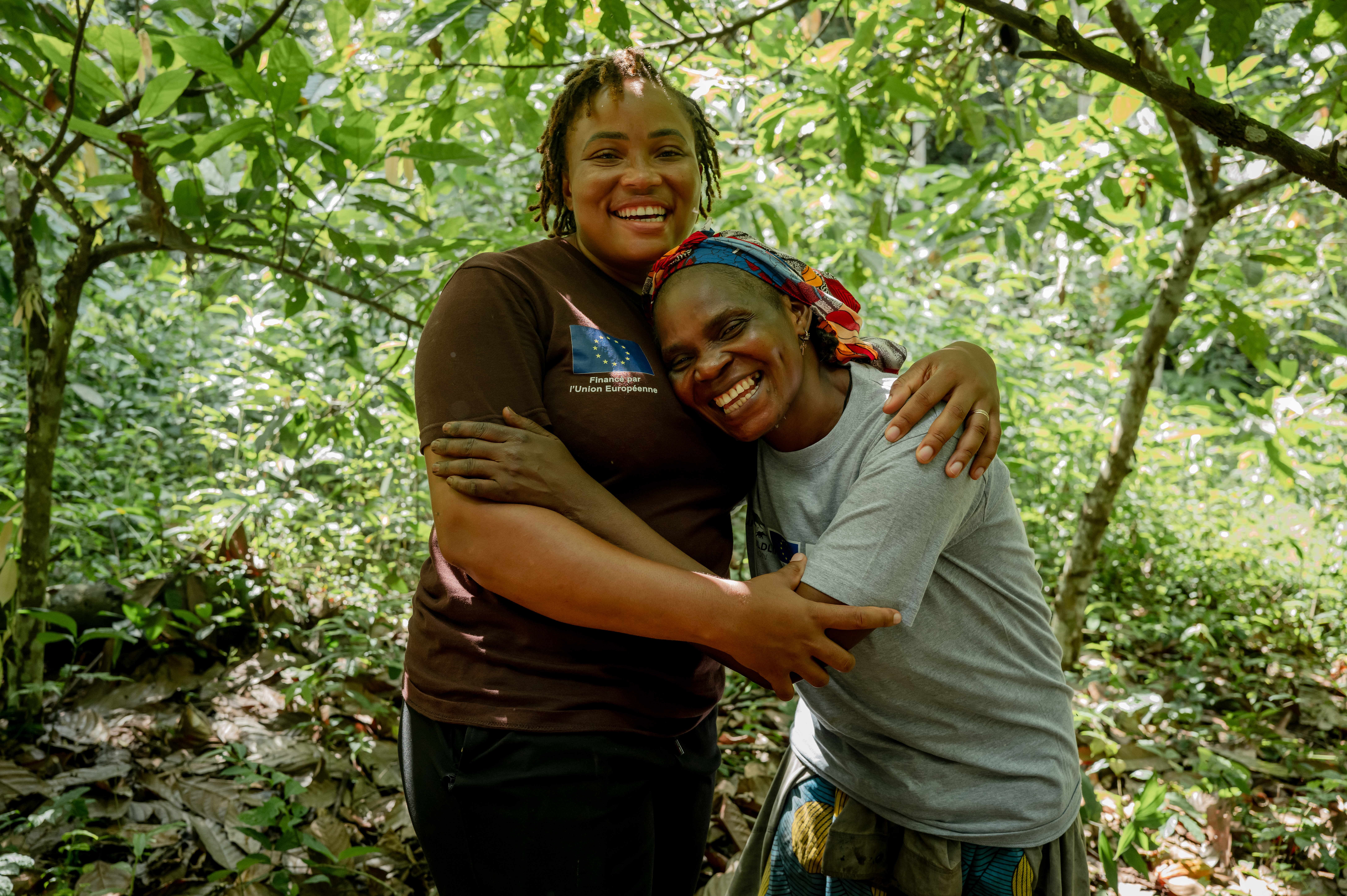 AWF STAFF ARIANNE FONDJO HUGS MANGO'O CLAUTILDE IN HER FARM IN DJA RESERVE, CAMEROUN