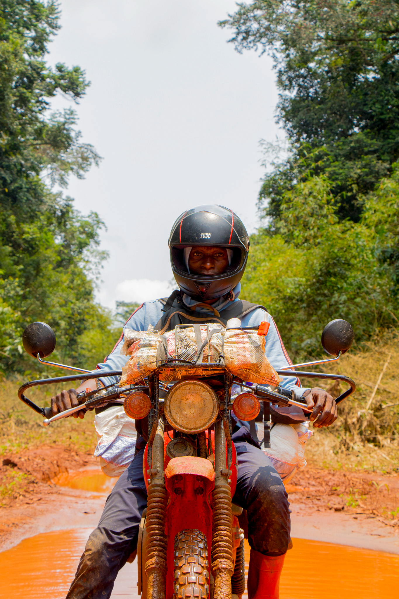 Jeancy Luaka emerges after a long and tedious journey through the forest. 