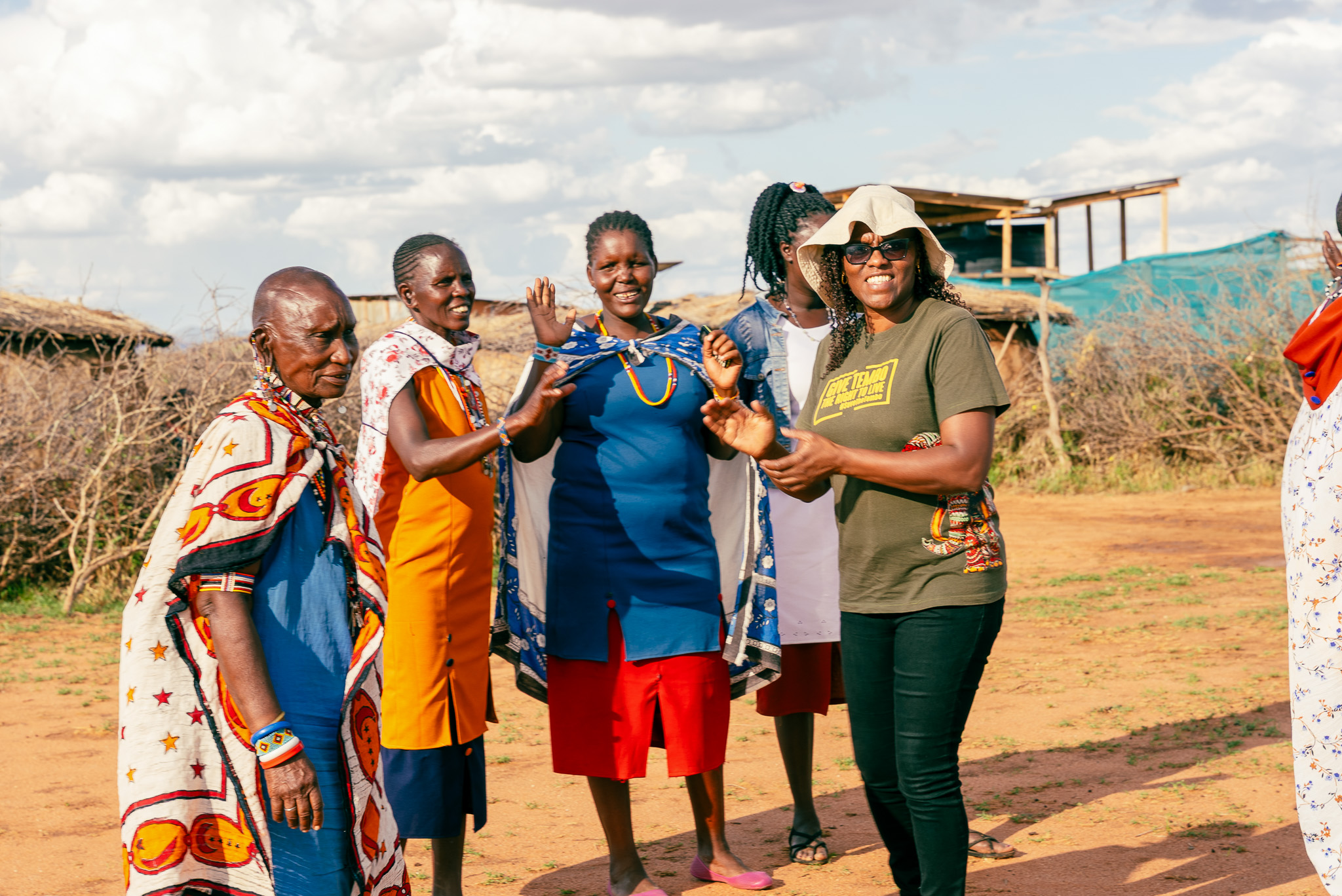 AWF Kenya Country Director, Nancy Githaiga (far left) enjoying sing and dance with some community members