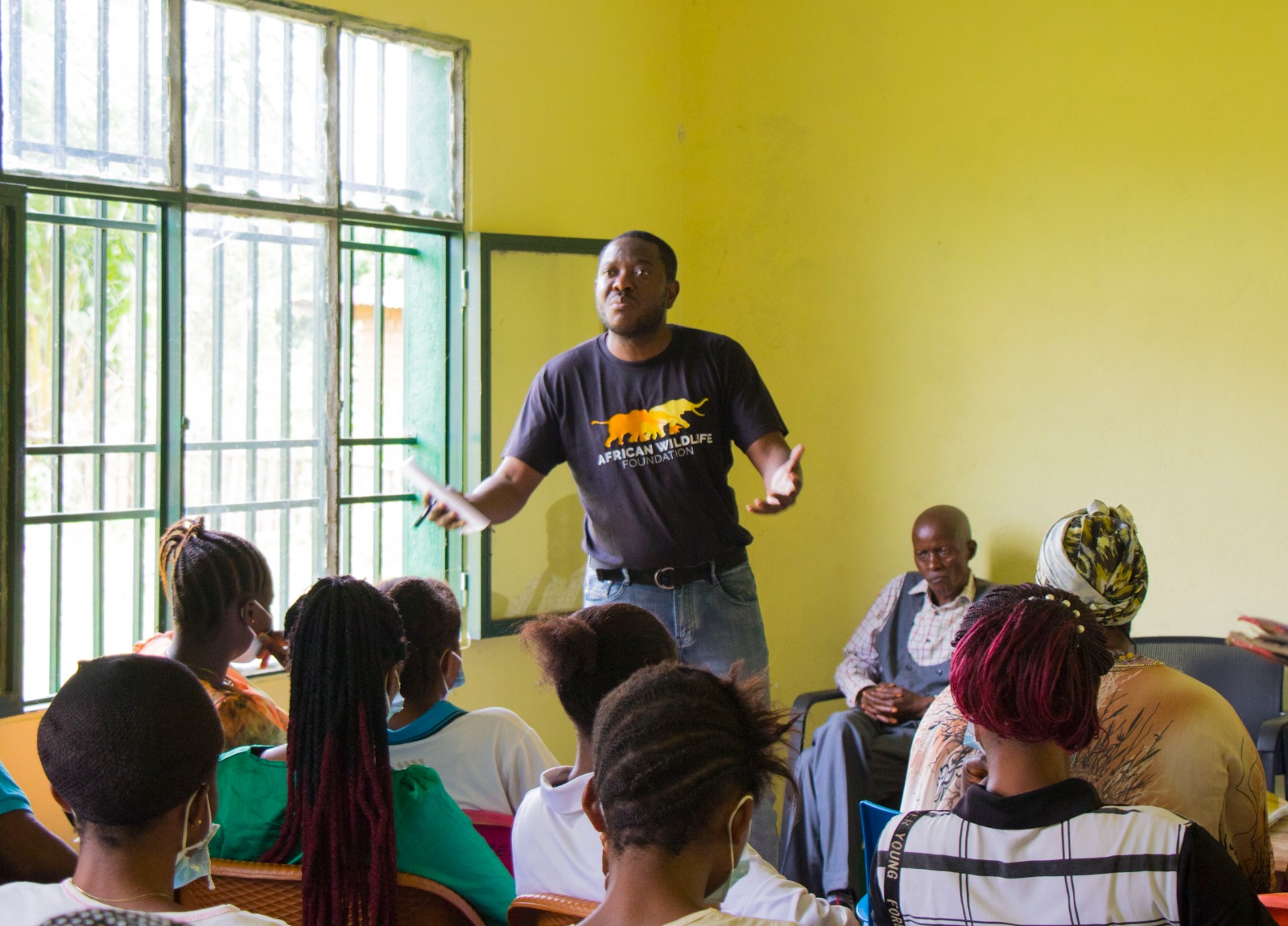 Dodo Moke discussing rights-based conservation with community members.