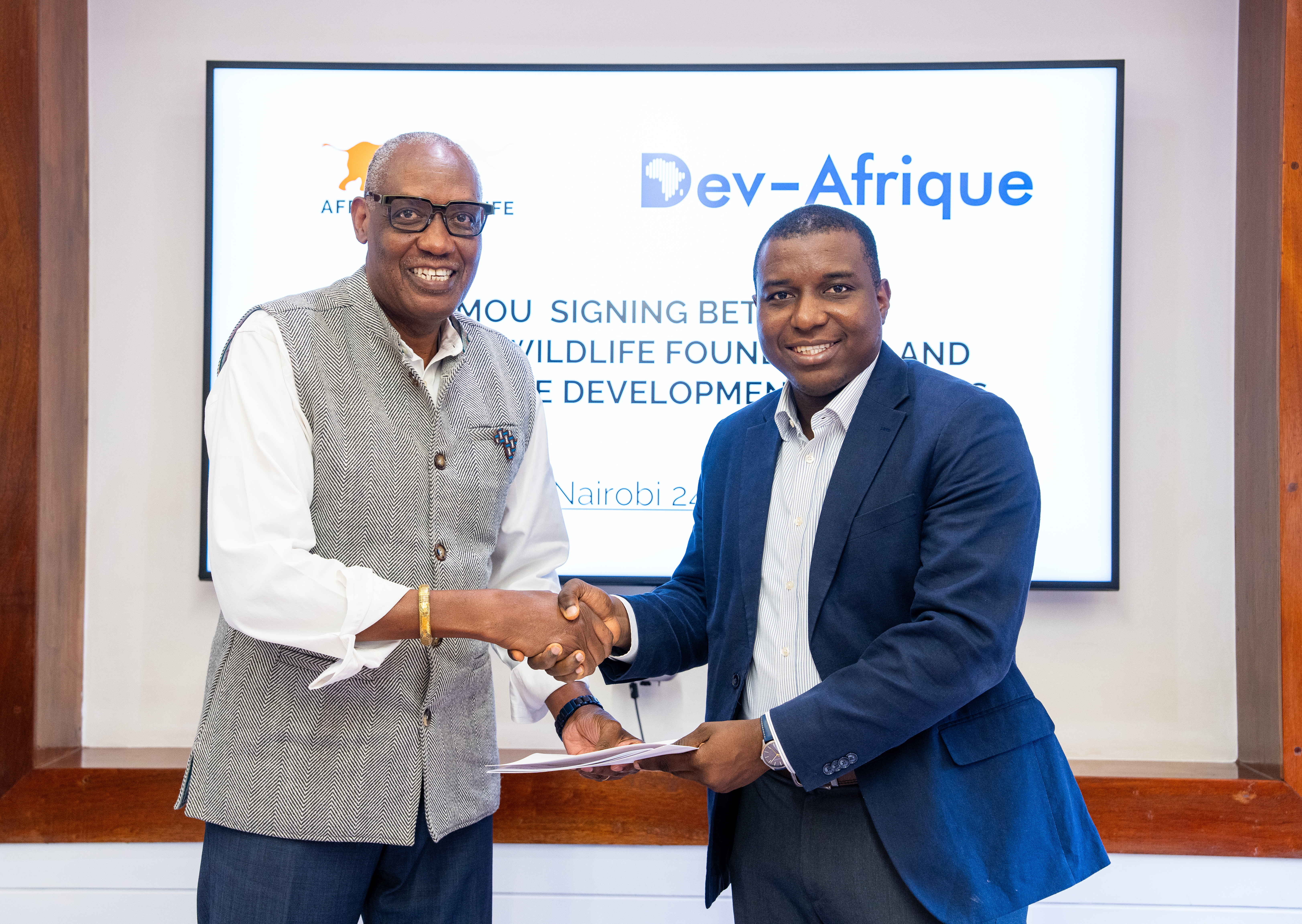 AWF CEO Kaddu Sebunya and Ridwan M. Sorunke, Founder and Managing Principal of Dev-Afrique Development Advisors, during the MoU signing at the AWF HeadQuarters in Nairobi, Kenya. 