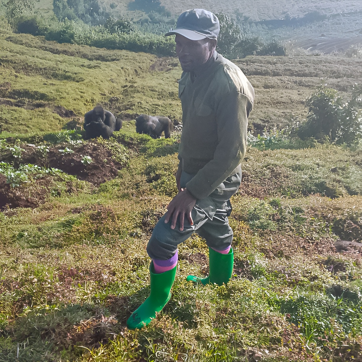 Hitimana Fideli, a Community Eco-Guard in Kinigi, contributing to climate resilience efforts around Volcanoes National Park through hands-on conservation work.