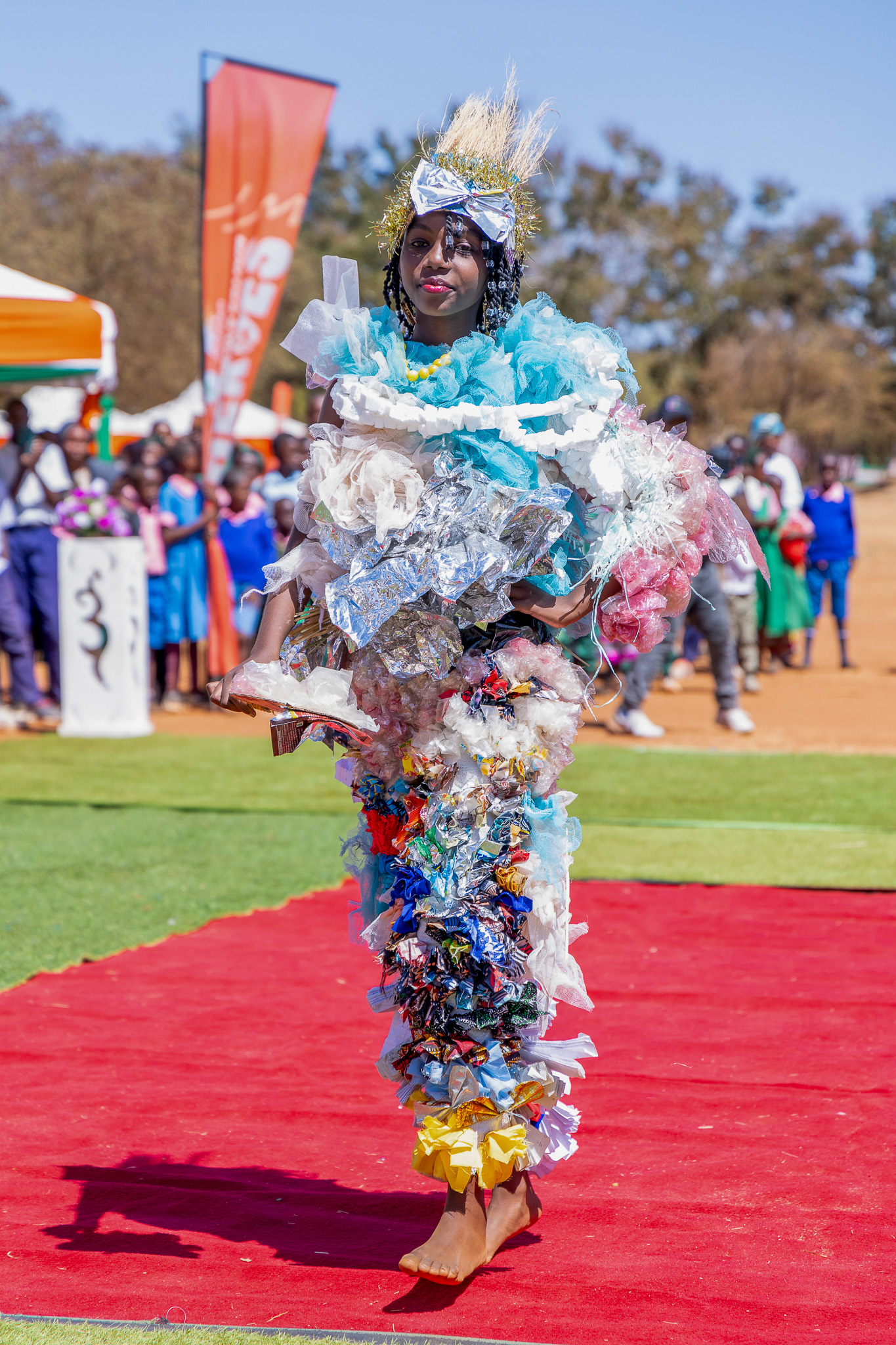 A learner presents her creative modelling entry to guests during the second Shujaa Zone Competition Award Ceremony.