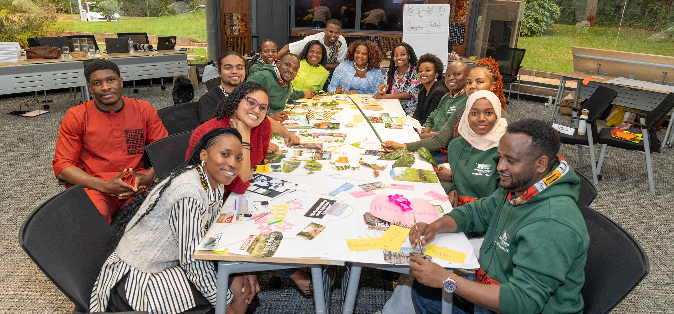 Manda Nfor with AWF-Wall Policy fellows after a creative demonstration of CBD COP procedure at AWF's headquarters in Nairobi, Kenya. 