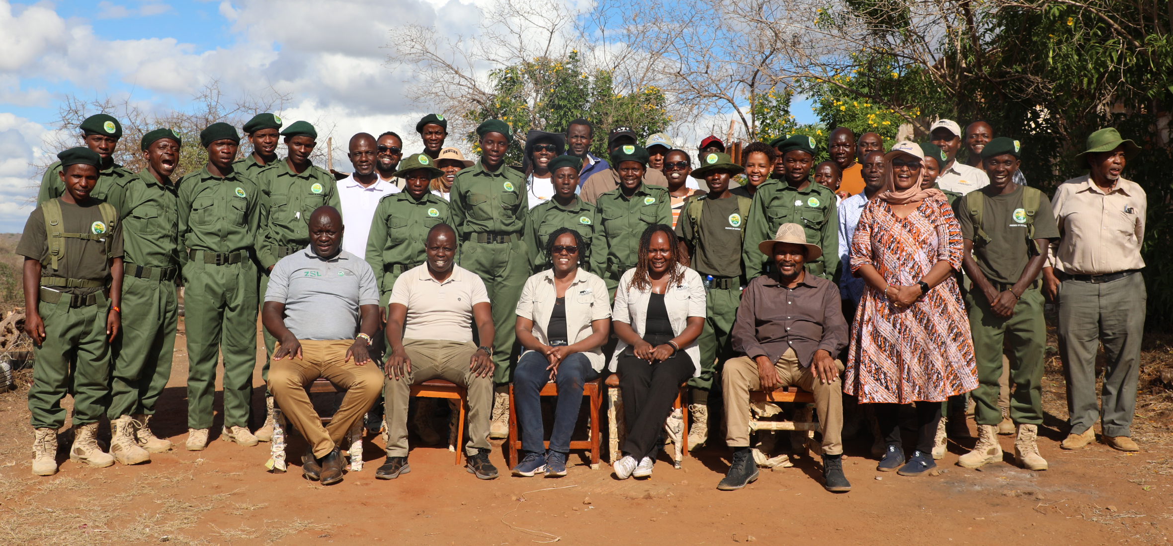 AWF Kenya Country Director Nancy Githaiga (middle, front row) with Amaka staff and rangers after breaking ground on two community rangers housing units.