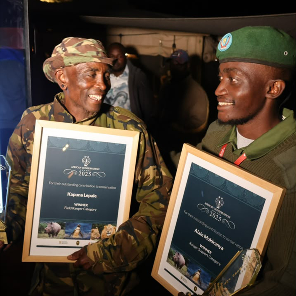 Alain and his colleague celebrate receiving awards for their contribution to conservation in 2025. 