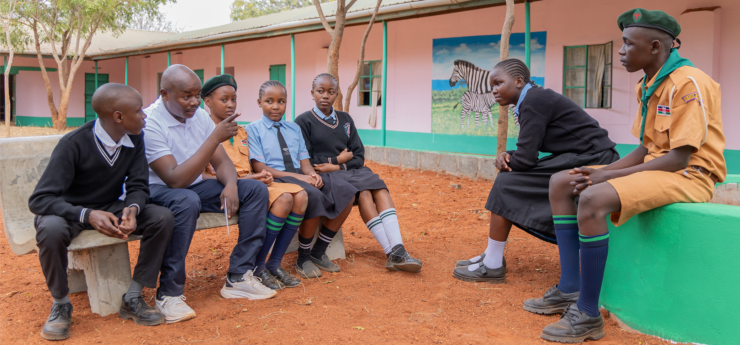 Patrick Kiminza leads a conservation learning session with students. © AWF