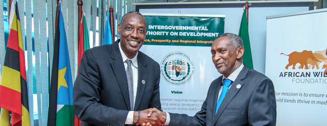 Photo of AWF CEO Kaddu Sebunya signing MoU with Intergovernmental Authority on Development