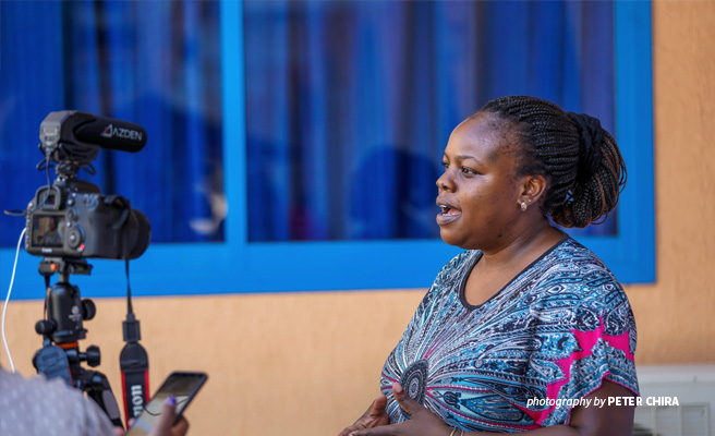 Photo of Senior Manager, Wildlife Law Enforcement Didi Wamukoya being during press interview in Uganda