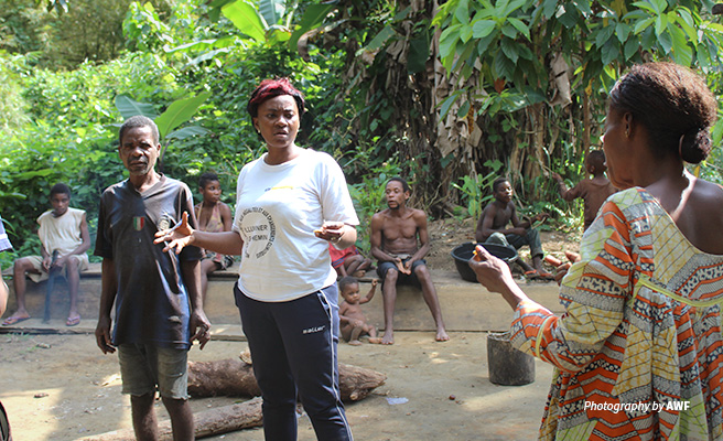 Photo of AWF Project Officer Stefany Noumeyi training community members in Campo Ma'an National Park