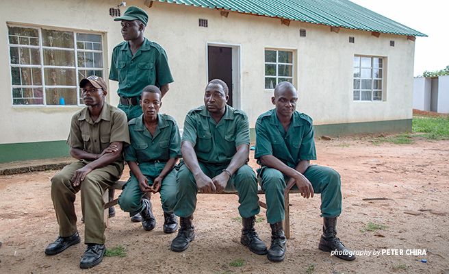 Mbire community wildlife scout Shylet Mugonapanja with colleagues