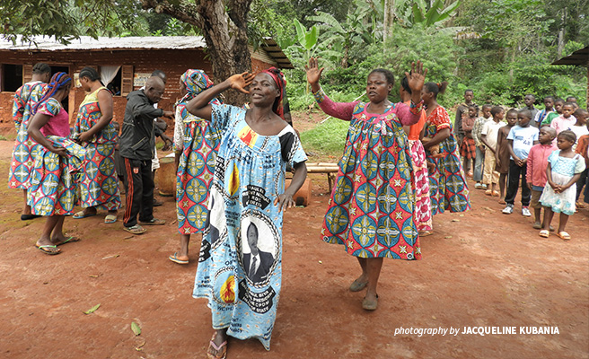 Photo of women from Kagnnole village dancing during a visit to the AWF conservation project site