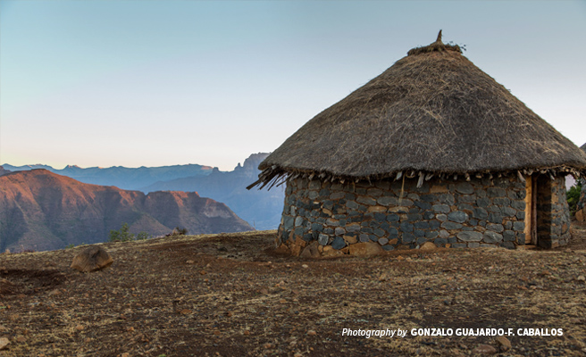 Landscape photo of hut overlooking cliff in the Simien Mountains