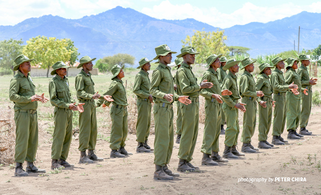 Photo of trained Tanzanian community scouts at graduation ceremony in Toloha