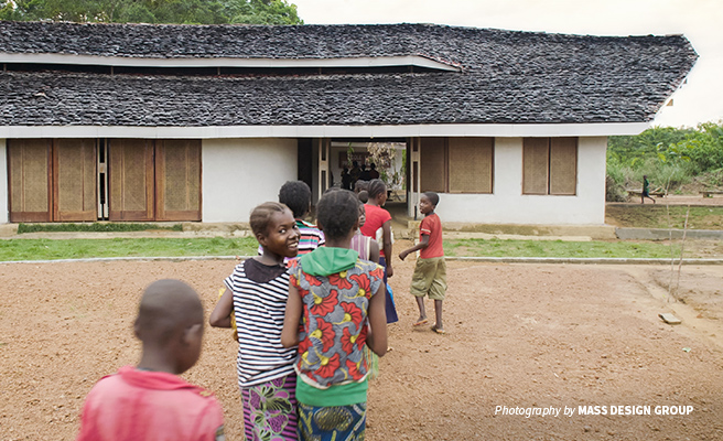 Photo of rural DRC primary school students entering new Ilima Conservation School building