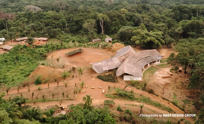 Aerial photo of Ilima Conservation Primary School adjacent to tropical forest in DRC