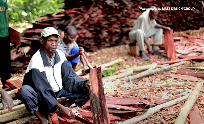 Photo of community members preparing wooden shingles at construction site of Ilima Conservation Primary School Photo of community members preparing wooden shingles at construction site of Ilima Conservation Primary School
