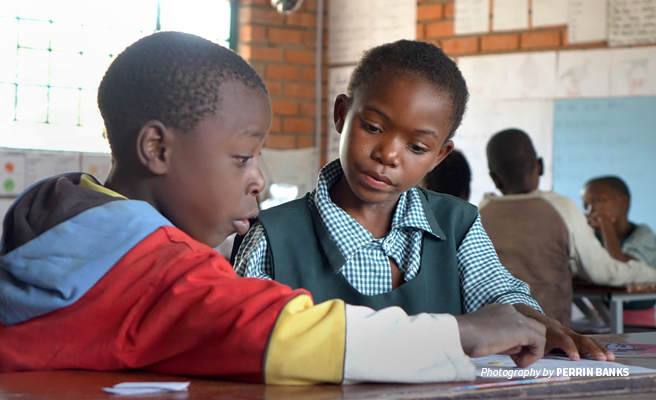 Photo of two students learning at AWF's Classroom Africa Lupani Community School Photo of two students learning at AWF's Classroom Africa Lupani Community School