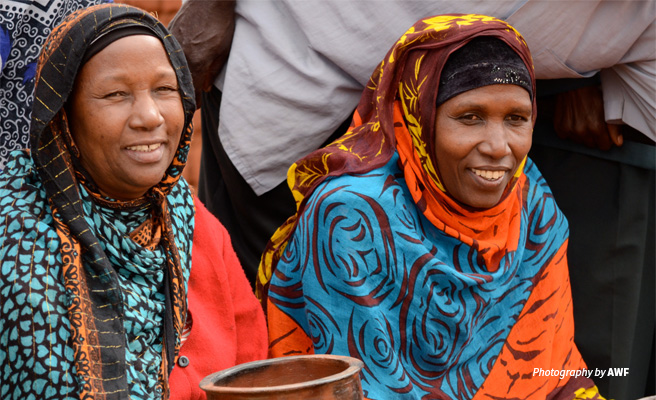Photo of two women from rural Tanzania invovled in AWF conservation project