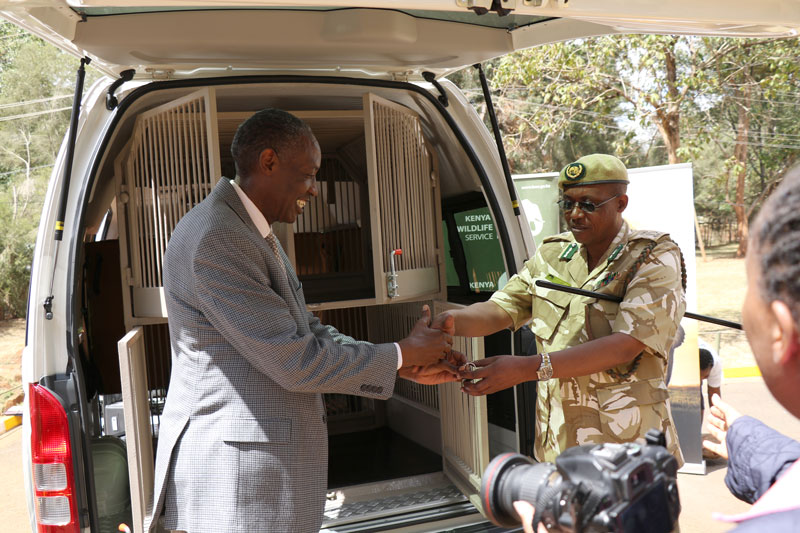 African Wildlife Foundation President Kaddu Sebunya shaking hands with Kenya Wildlife Service representative