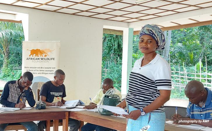 A woman stands in a business training