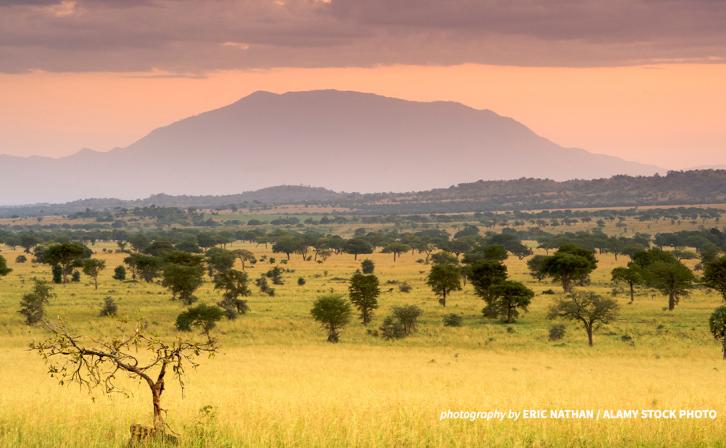 Dawn breaks behind a mountain in Kidepo Valley National Park.