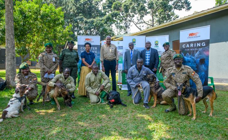 AWF CEO, Kaddu Sebunya, AWF Uganda Country Director Rose Ssebatindira and Uganda Wildlife Authority Representatives during the program transition ceremony for the Canine Units in Uganda   