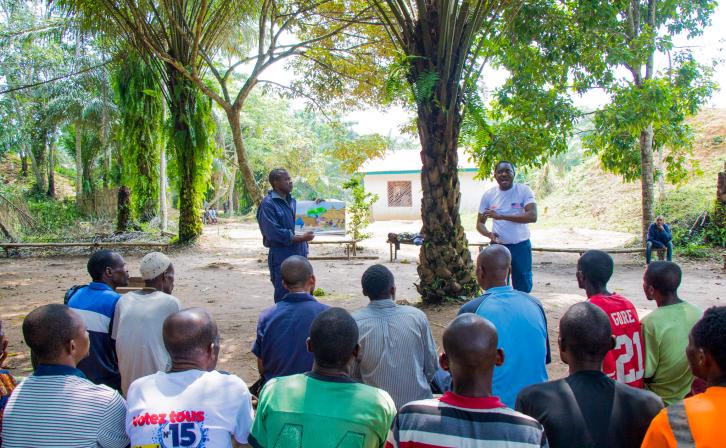 Jean Ayolo Yokolo and AWF Senior Social Safeguards Officer, Dodo Moke at one of their presentations to the scouts