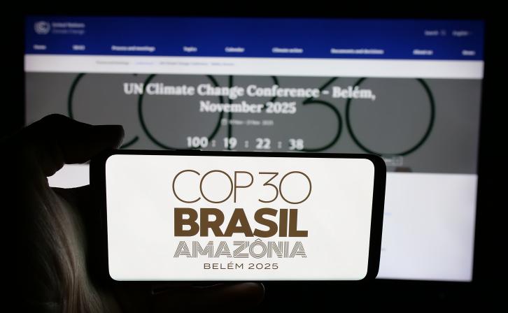 Logo of UN climate change conference COP30 in Brazil on screen in front of webpage.