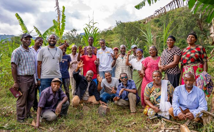 Chief Simon Mwakio (far left) with community members engaged in restoration efforts across Bura