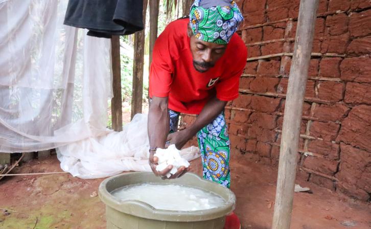Ndamey Rene showing some of the cassava he harvested from his farm in January 2026.