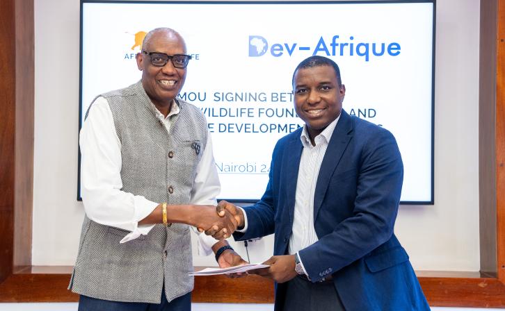 AWF CEO Kaddu Sebunya and Ridwan M. Sorunke, Founder and Managing Principal of Dev-Afrique Development Advisors, during the MoU signing at the AWF HeadQuarters in Nairobi, Kenya. 